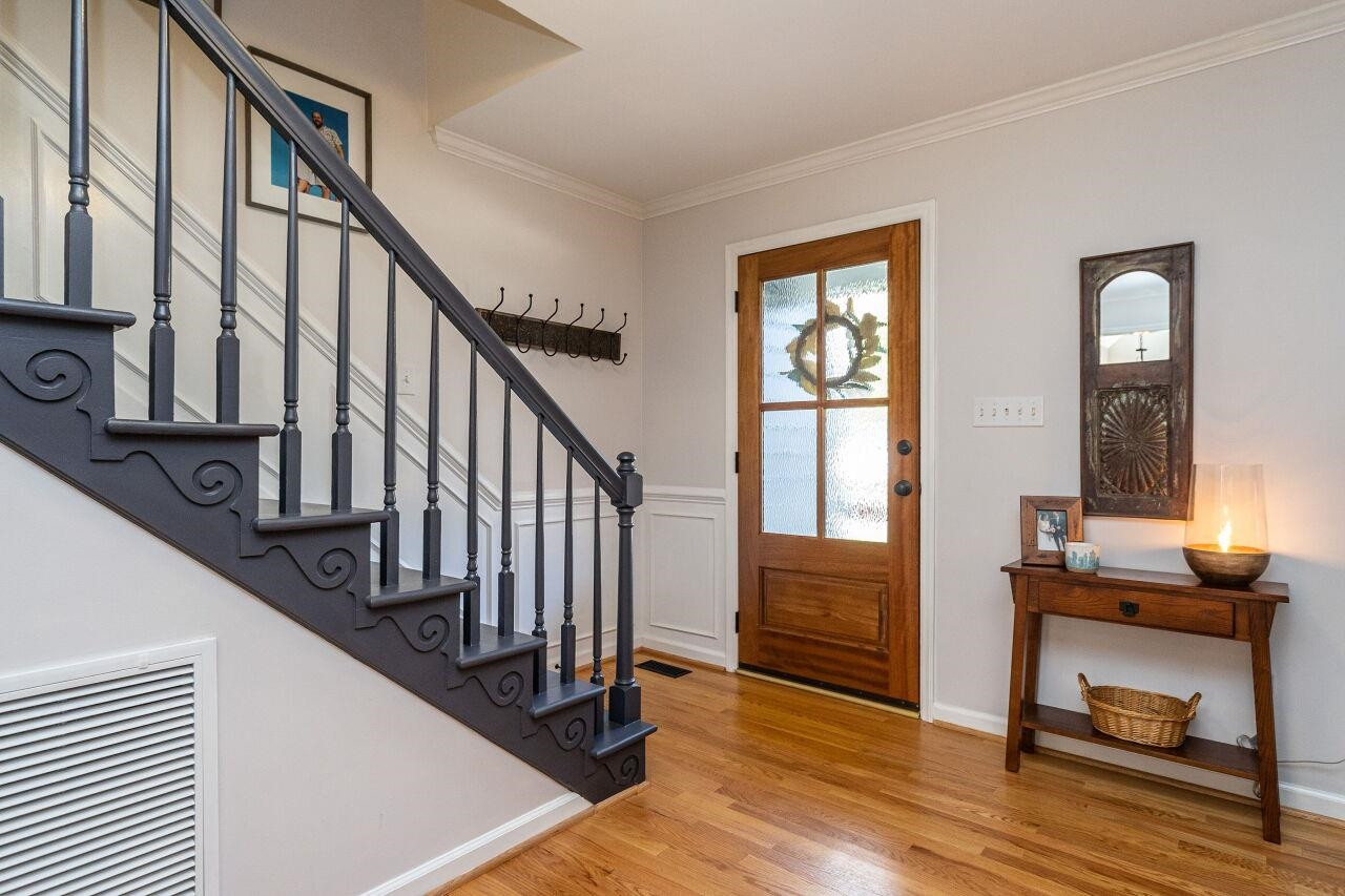 5905 Stable Court Raleigh, NC 27612 - Photo 22 of 30 a view of an entryway with wooden floor and door