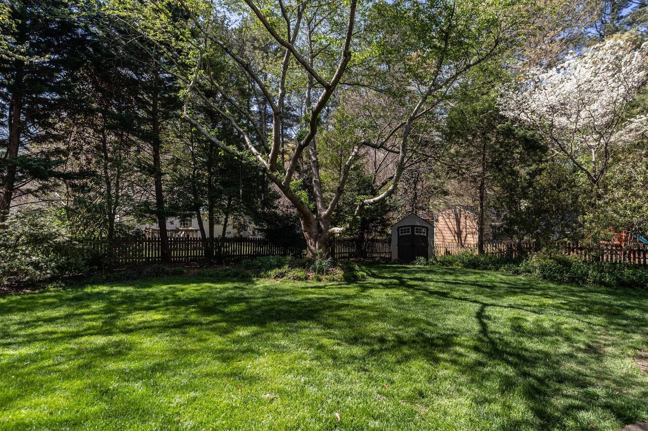 5905 Stable Court Raleigh, NC 27612 - Photo 26 of 30 a backyard of a house with lots of green space and fountain