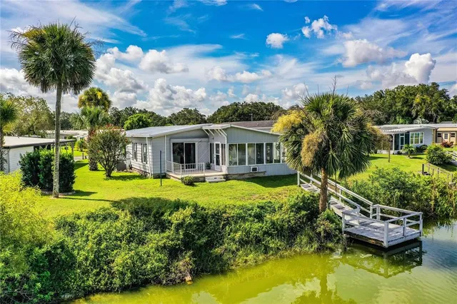 a kitchen with stainless steel appliances granite countertop a refrigerator and a stove