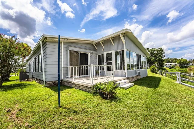 a front view of a house with a yard table and chairs
