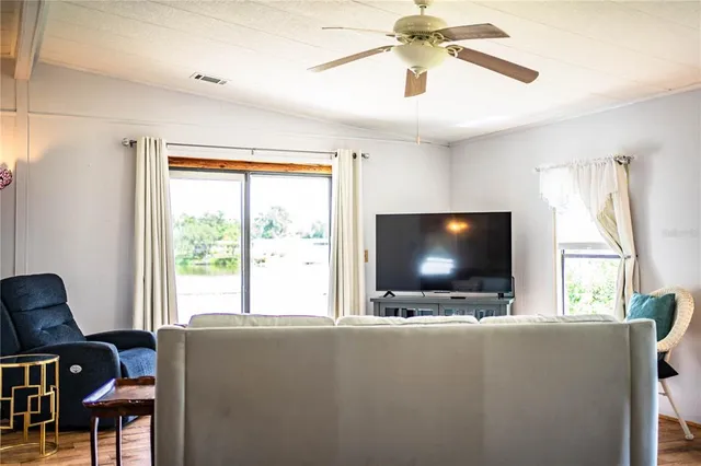 a bedroom with a bed and flat screen tv