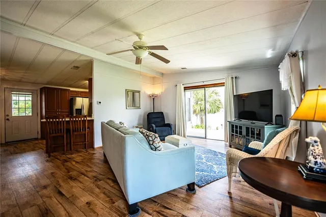a bedroom with bed and wooden floor