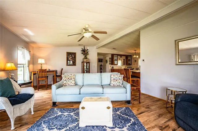 a bed room with furniture and flat screen tv