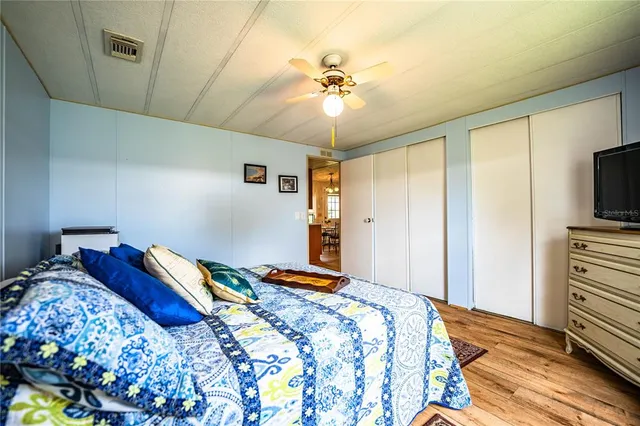 a bathroom with a granite countertop toilet sink and mirror