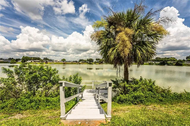 a view of a lake with a house in the background