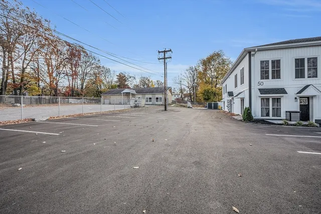 a view of a road with a building in the background