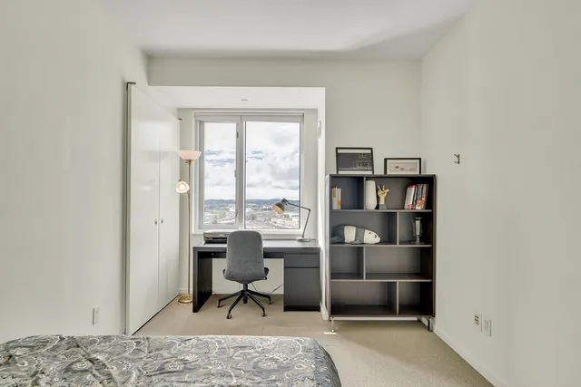 a workspace with furniture and a window