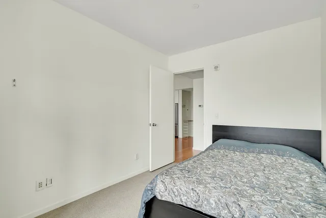 a bedroom with a bed and a cabinets