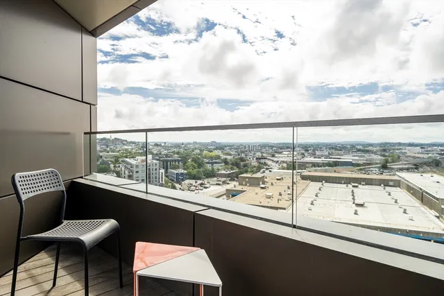 a view of a chairs and table in a balcony