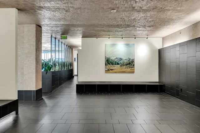 a view of swimming pool with outdoor seating and a window