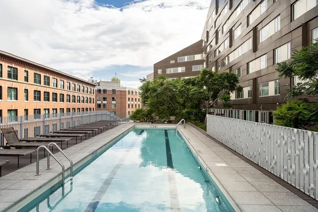 a view of balcony with a swimming pool