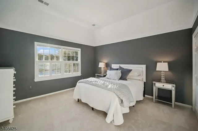 a bedroom with a balcony a bed and with furniture