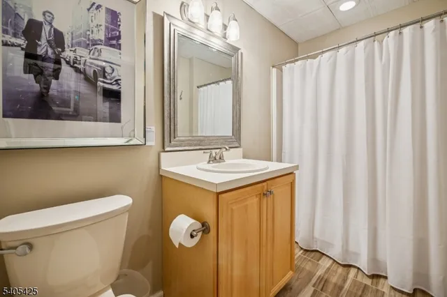 a balcony with wooden floor and outdoor seating