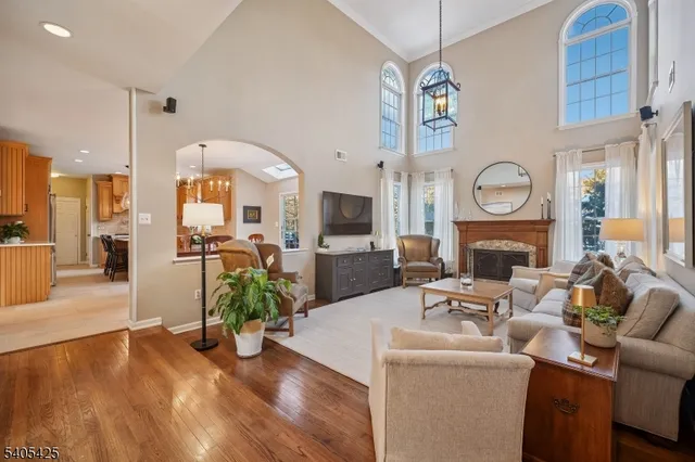 a dining room with furniture and a chandelier