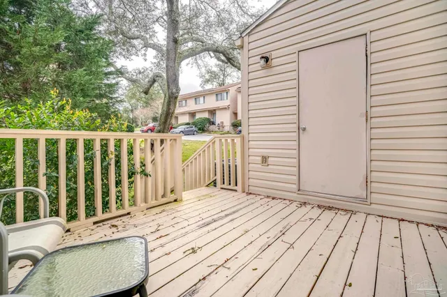 a view of a balcony with wooden floor