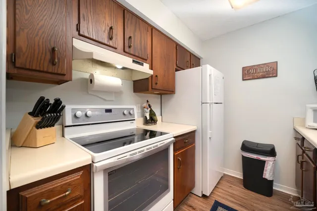 a kitchen with appliances and cabinets