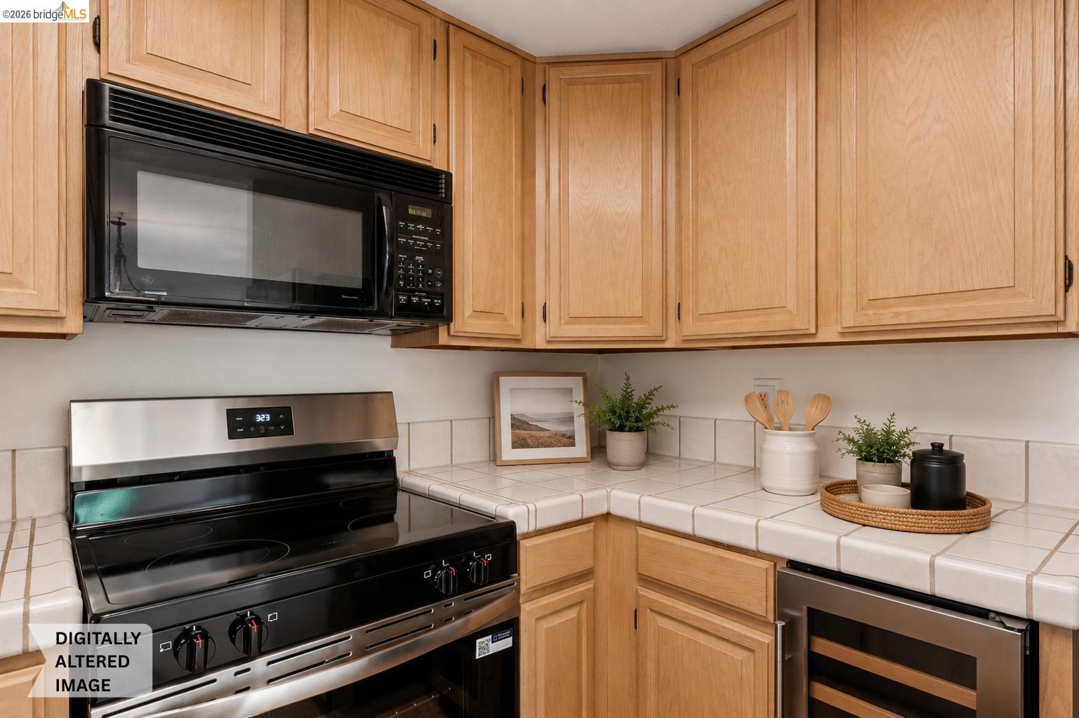 261 Redhawk Road Novato, CA 94949 - Photo 22 of 47 Kitchen featuring wood cabinetry, tile countertops, stainless steel range, built-in microwave, and an under-counter beverage refrigerator