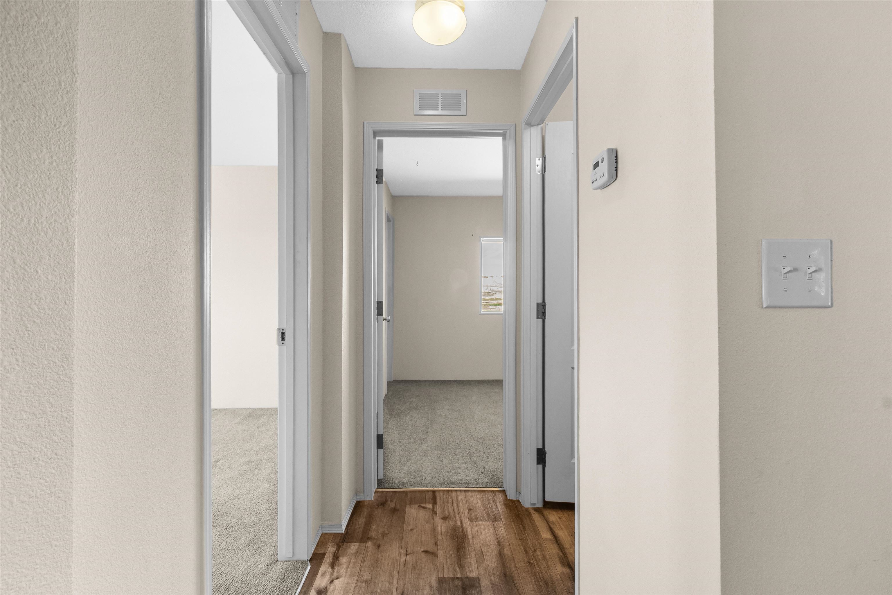 759 33 Road Clifton, CO 81520 - Photo 17 of 35 a view of a hallway with wooden floor and closet