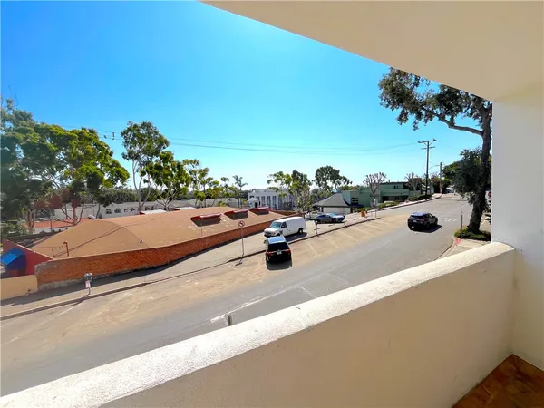 a view of a street with cars
