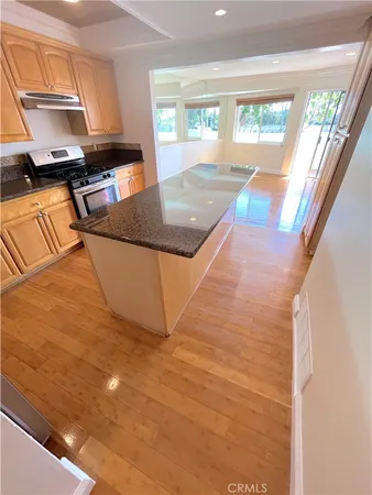 a view of a kitchen with a sink and cabinets