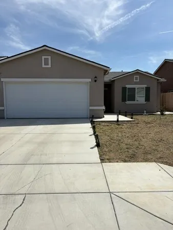 a front view of a house with yard