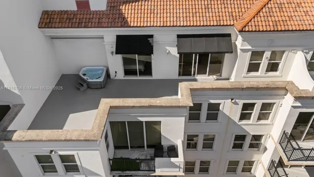 an aerial view of a house with a yard and garden