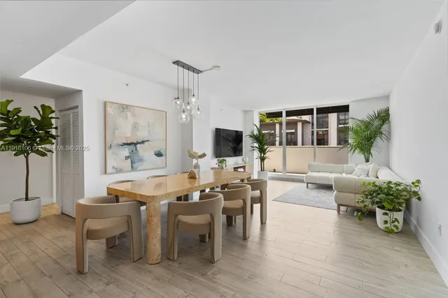 a kitchen with a table and chairs