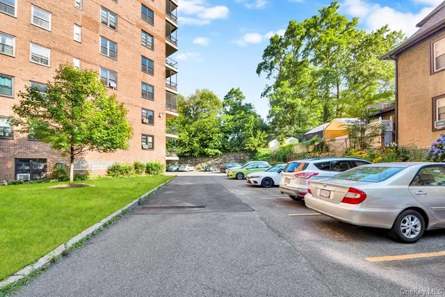 a view of a cars parked in front of a building
