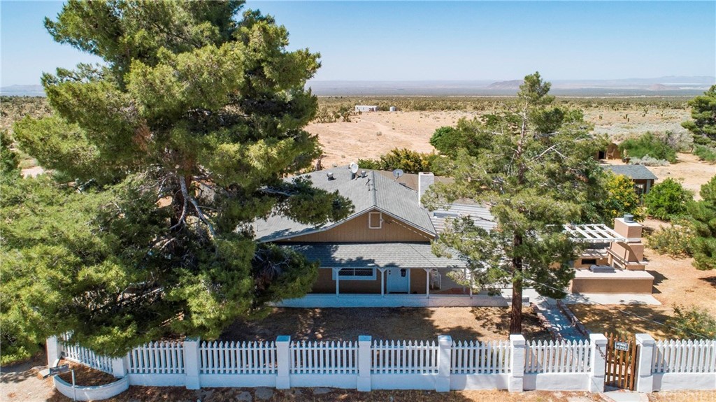 21123 Fort Tejon Road Llano, CA 93544 - Photo 20 of 55 a view of a house with a yard