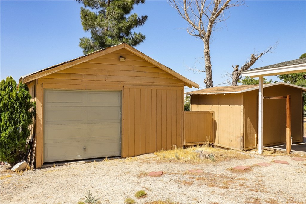 21123 Fort Tejon Road Llano, CA 93544 - Photo 37 of 55 a view of a house with a yard