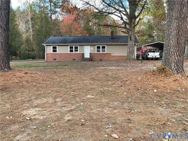 a house view with a car parked in front of house