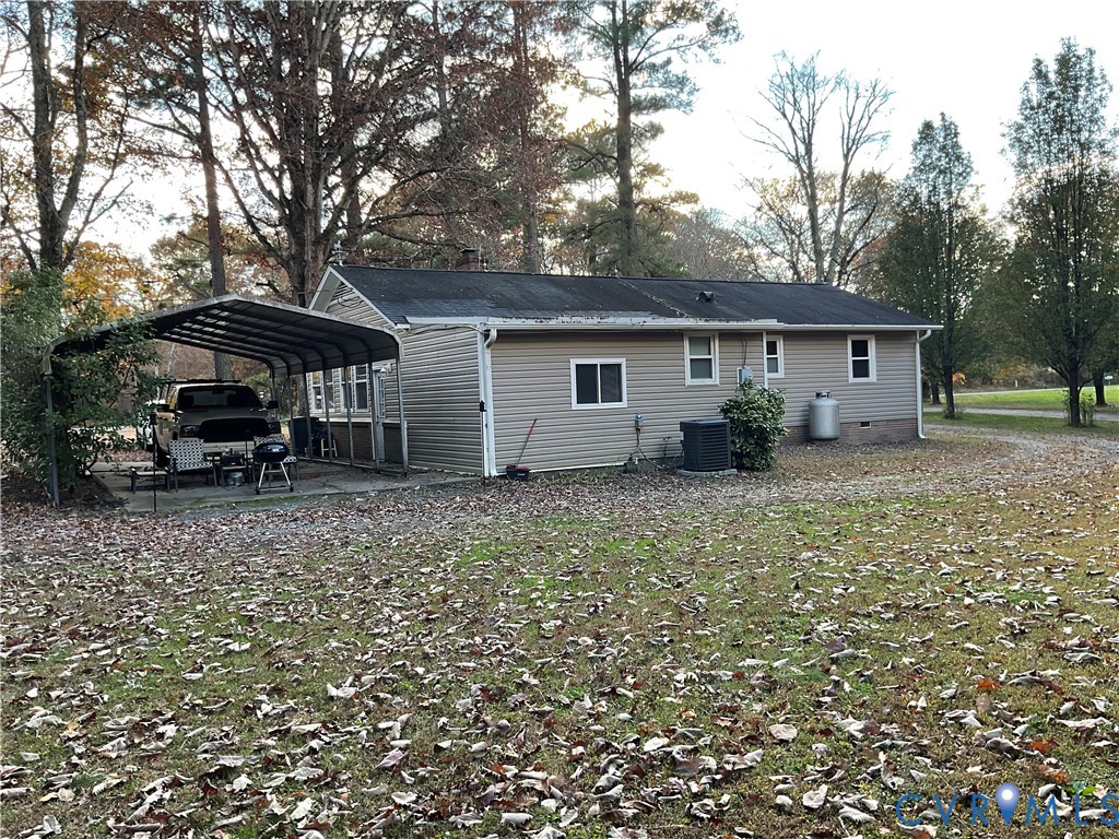 30 Custis Millpond Road West Point, VA 23181 - Photo 17 of 22 Back of house with a patio area, a carport, and a