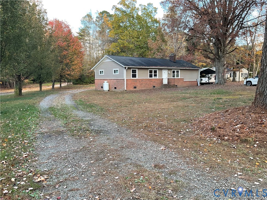 30 Custis Millpond Road West Point, VA 23181 - Photo 19 of 22 View of front of home with brick siding, a chimney