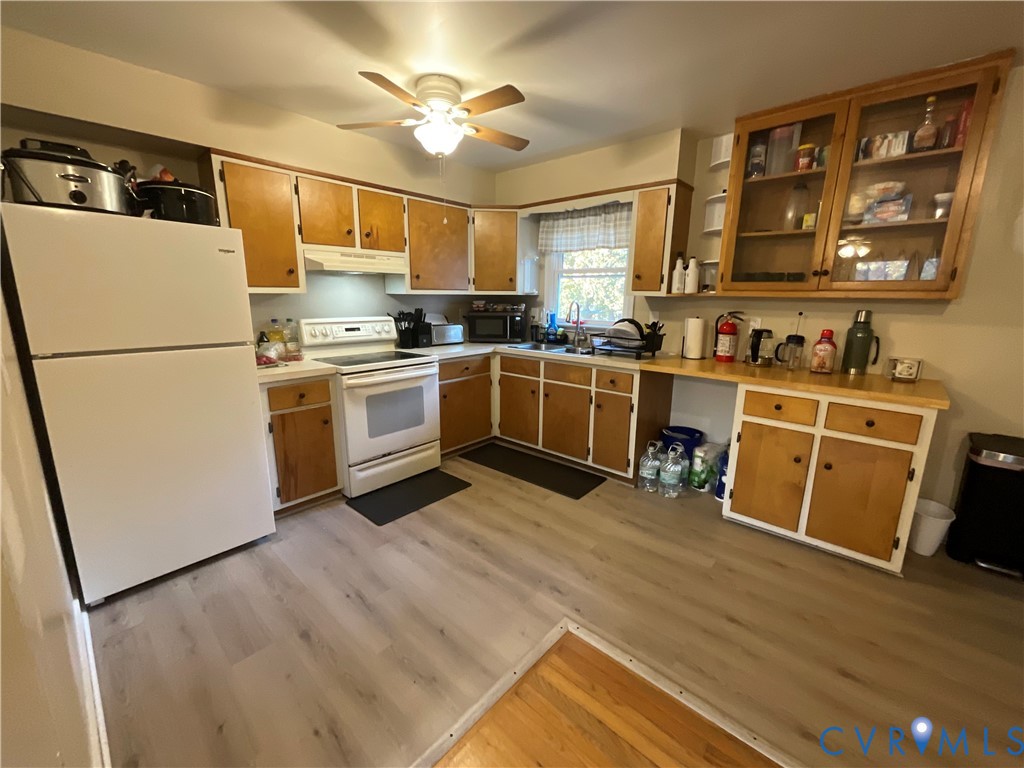 30 Custis Millpond Road West Point, VA 23181 - Photo 5 of 22 Kitchen with open shelves, white appliances, light