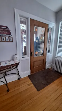 a living room with a couch and a window