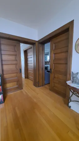 a view of an empty room and fire place