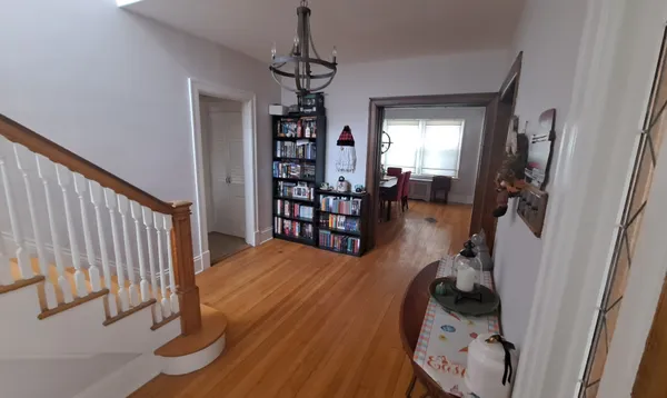 a view of a livingroom with furniture and staircase