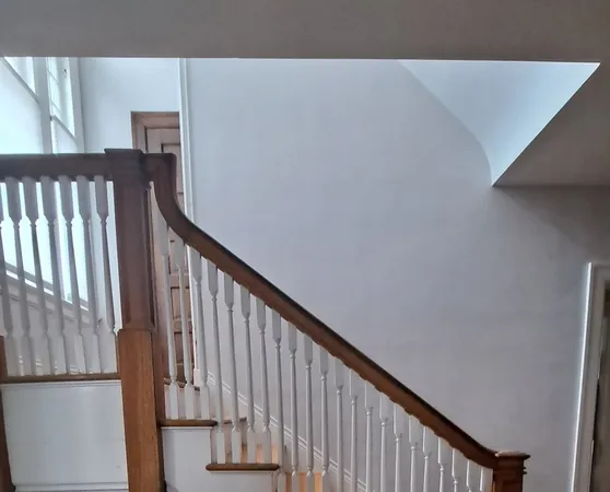a view of a hallway with staircase