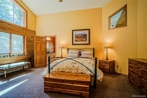 a bedroom with furniture and a window