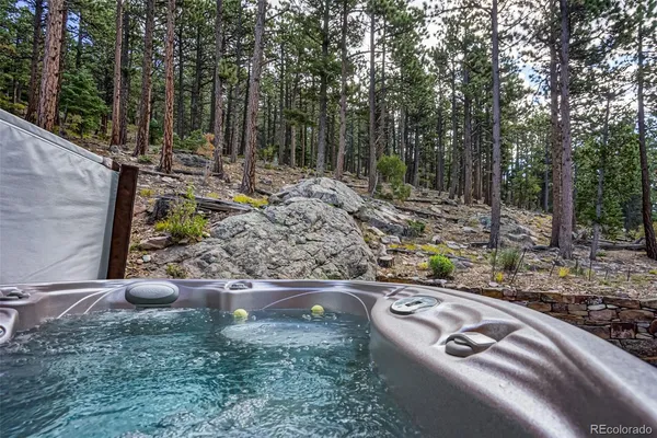 a view of a backyard with fire pit