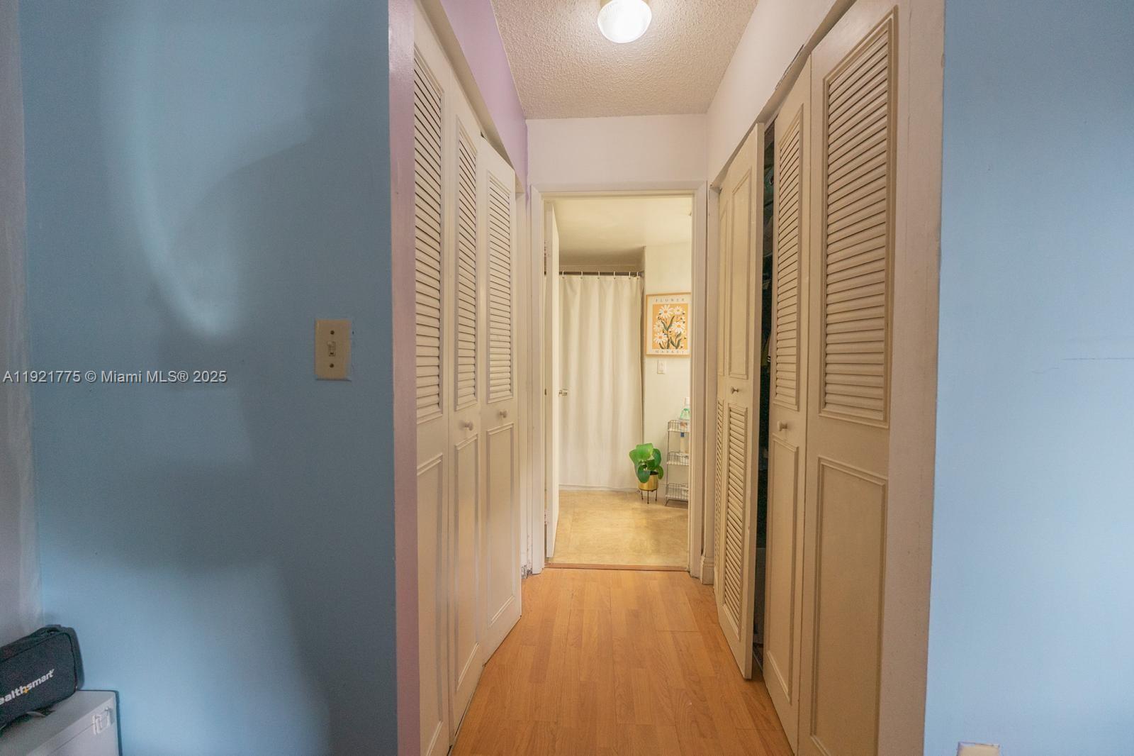 6276 Northwest 186th Street, Unit 112 Hialeah, FL 33015 - Photo 16 of 22 a view of a bathroom from a hallway