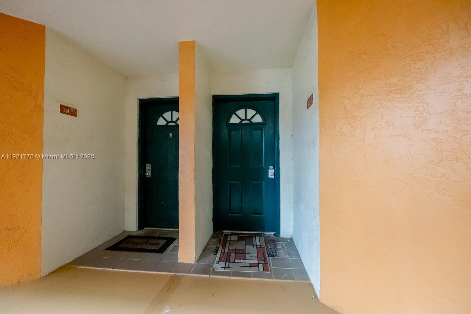 6276 Northwest 186th Street, Unit 112 Hialeah, FL 33015 - Photo 2 of 22 a view of hallway with mirror