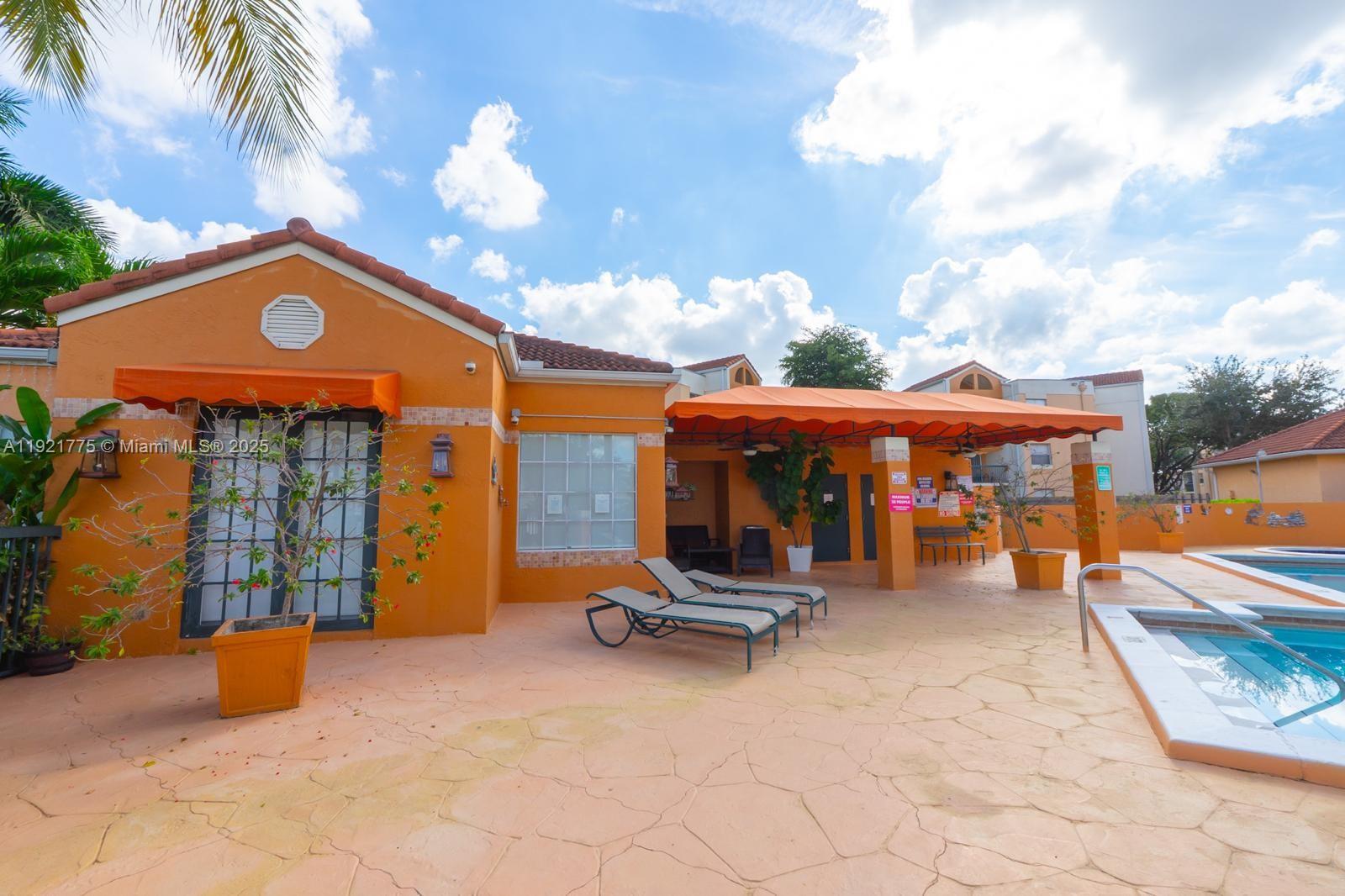6276 Northwest 186th Street, Unit 112 Hialeah, FL 33015 - Photo 21 of 22 a view of a chairs and tables in the patio
