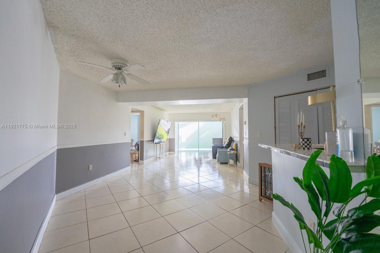 6276 Northwest 186th Street, Unit 112 Hialeah, FL 33015 - Photo 3 of 22 a living room with furniture