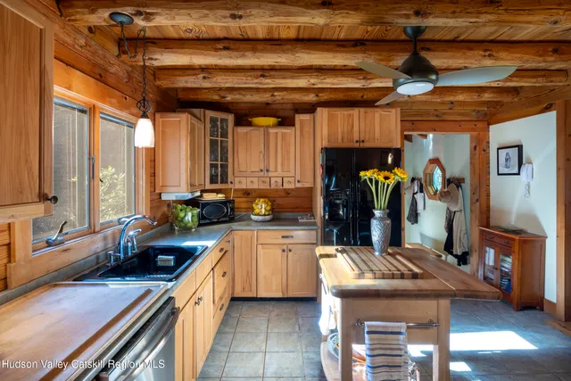 a kitchen that has a lot of cabinets in it