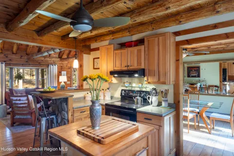a kitchen with lots of counter top space and dining table