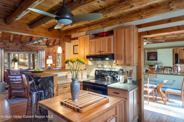 a kitchen with lots of counter top space and dining table