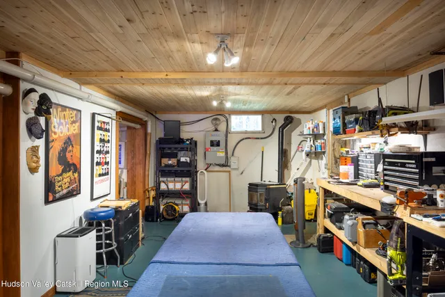 a view of a yard with plants and a bench
