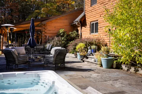 a view of a chairs and tables in the back yard of the house