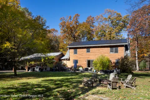 a fire hydrant in front of a tree